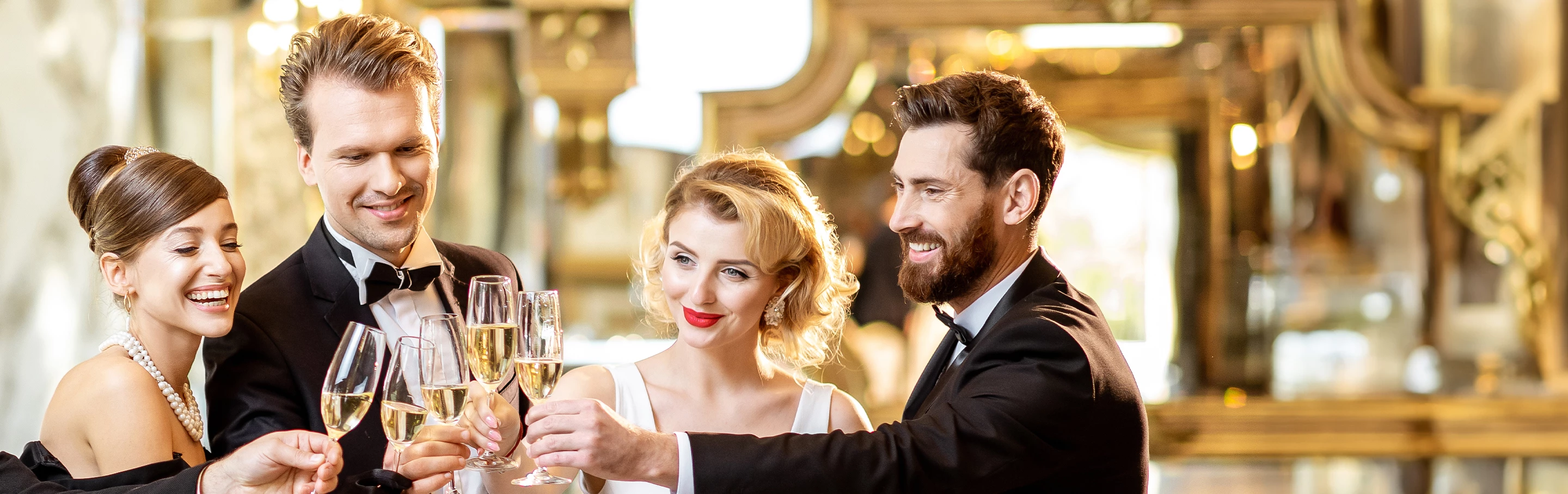 a group of people holding wine glasses
