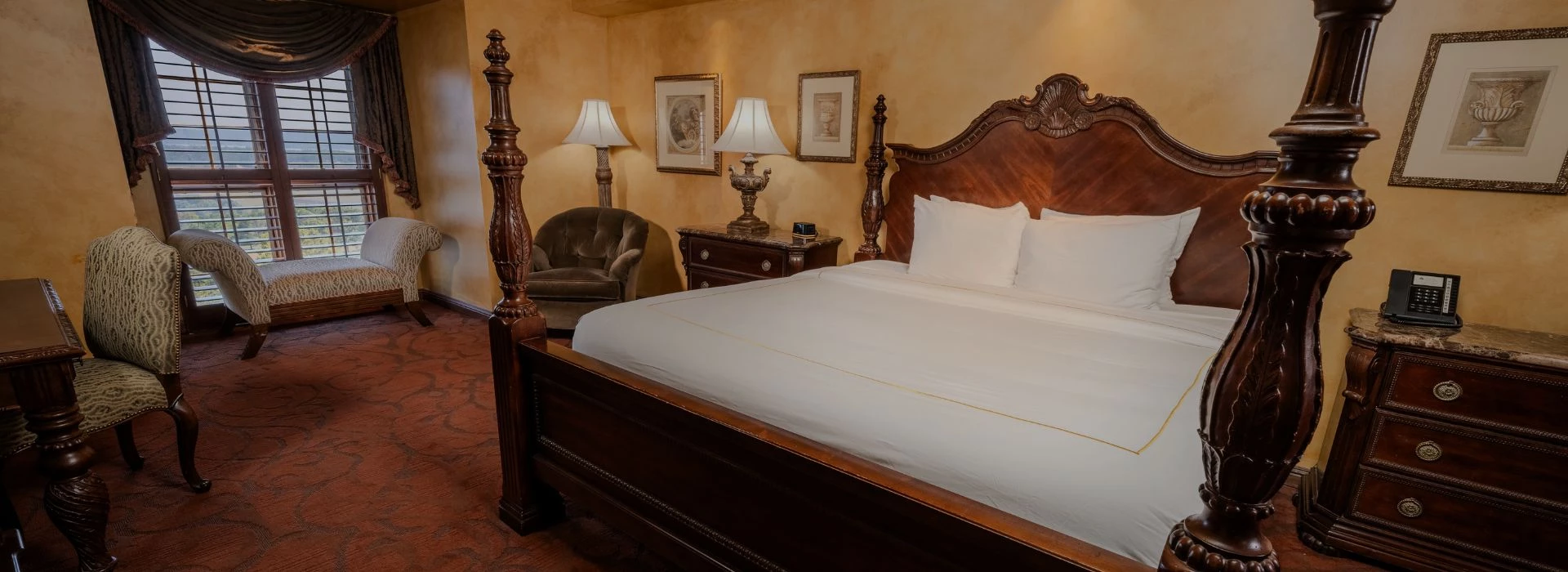a bed with a four poster bed