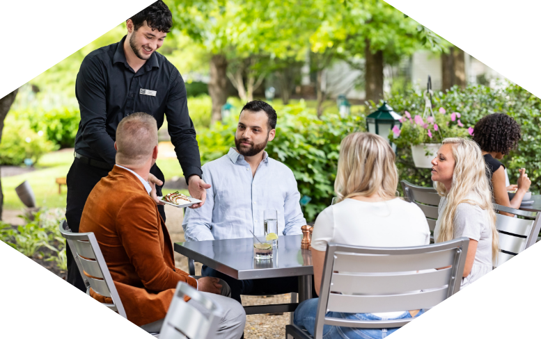 a group of people sitting at a table