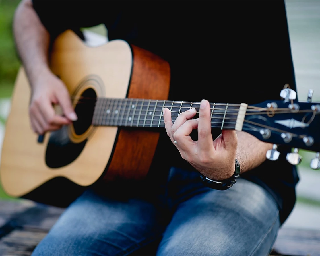 a person playing a guitar