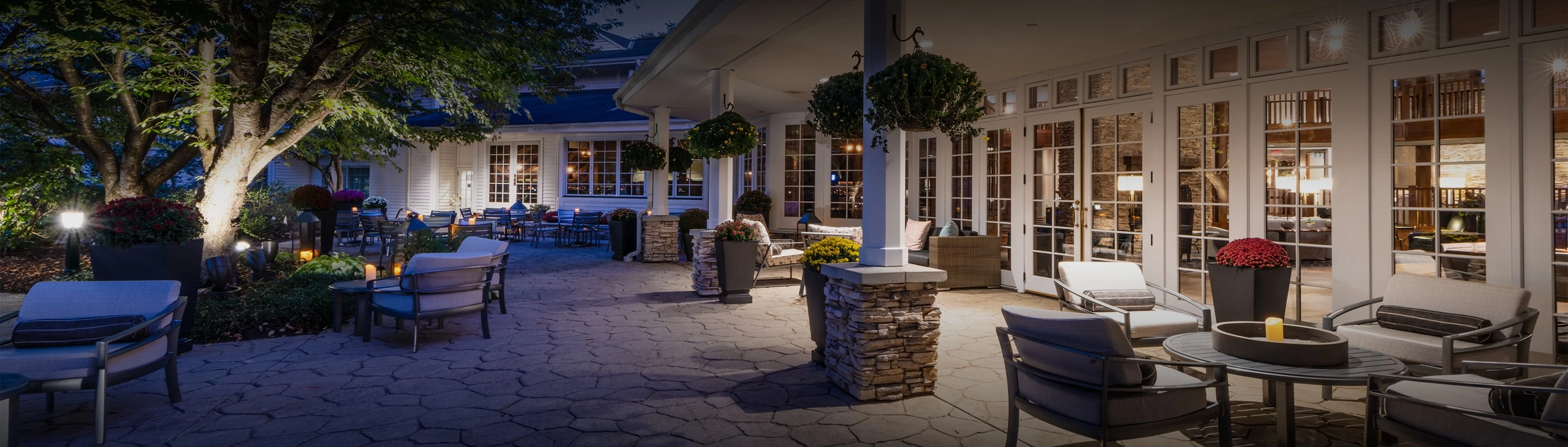 a courtyard with chairs and tables
