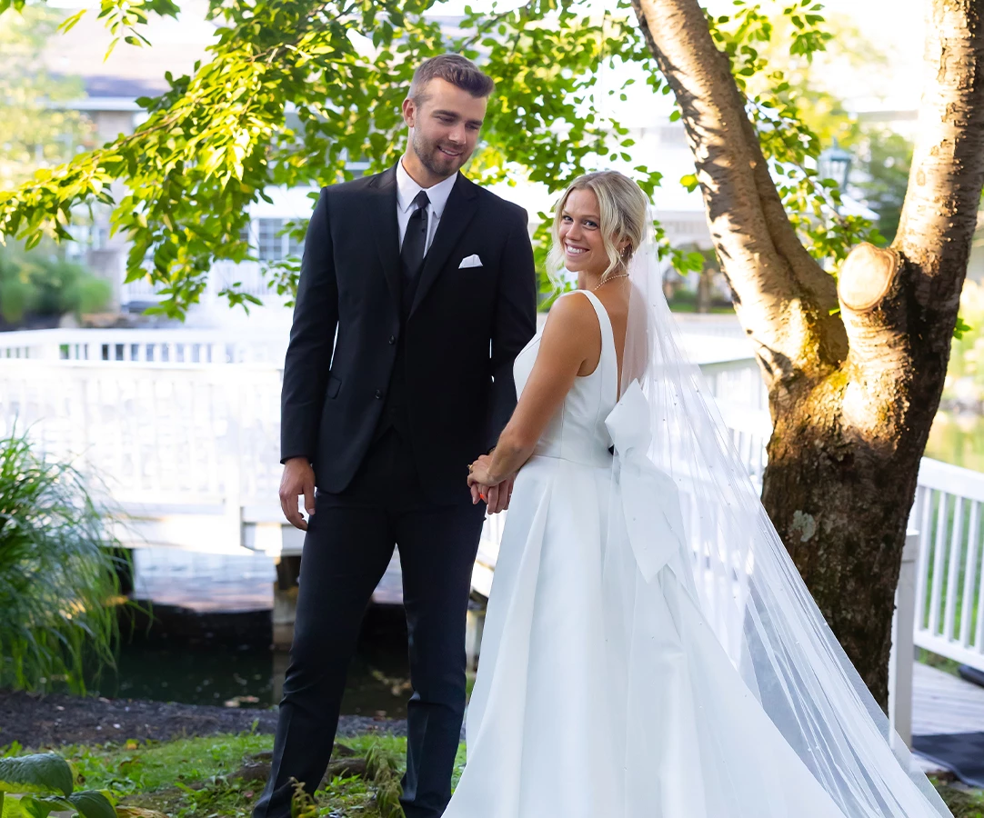 a man and woman in wedding attire