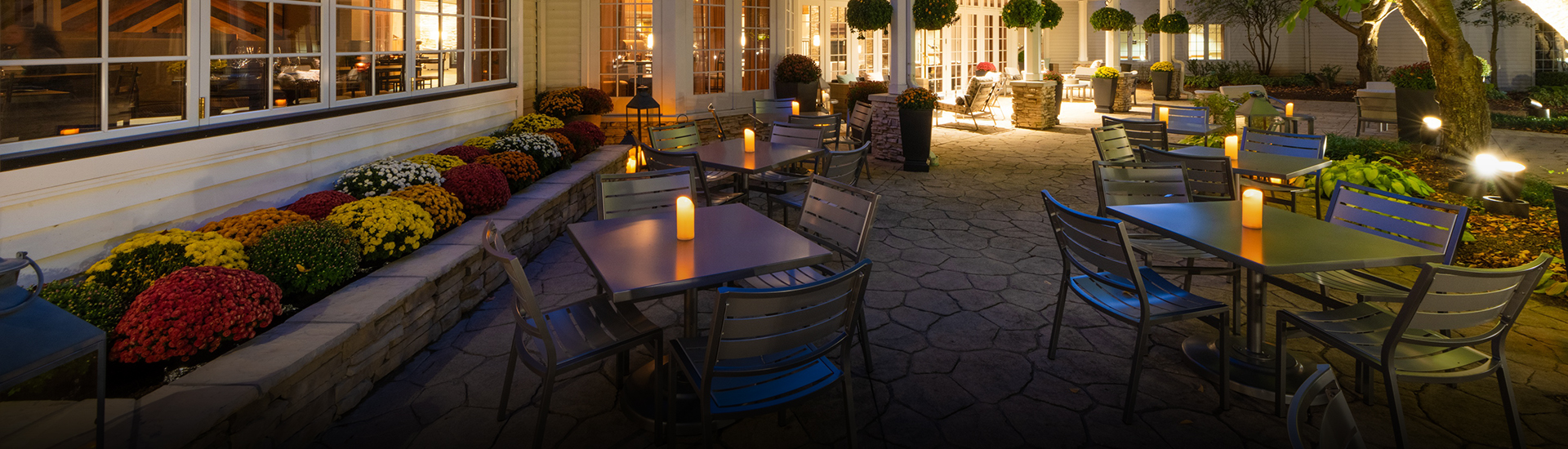 a table and chairs outside of a building