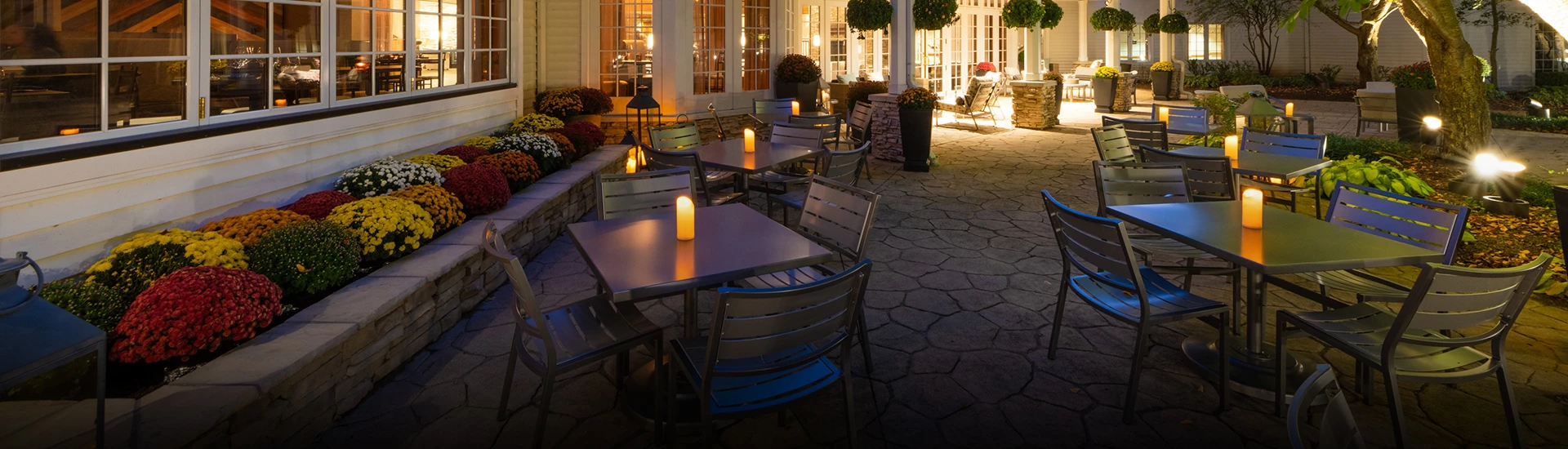 a table and chairs outside of a building
