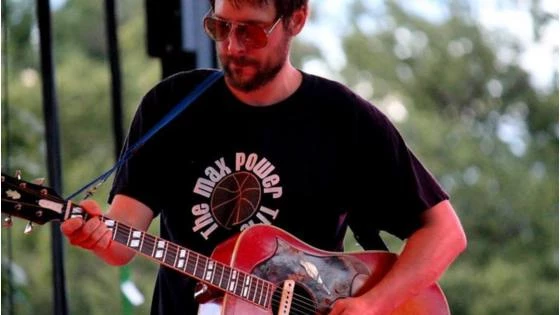 a jesse barr playing a guitar