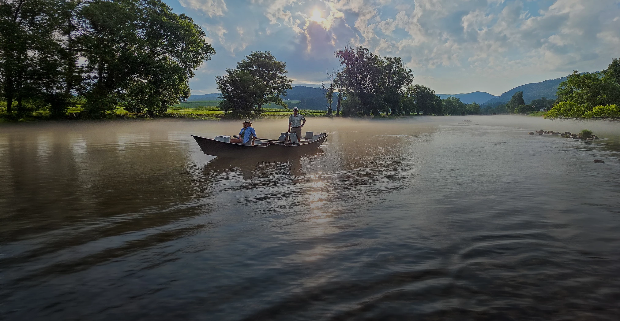 a group of people in a boat on a lake