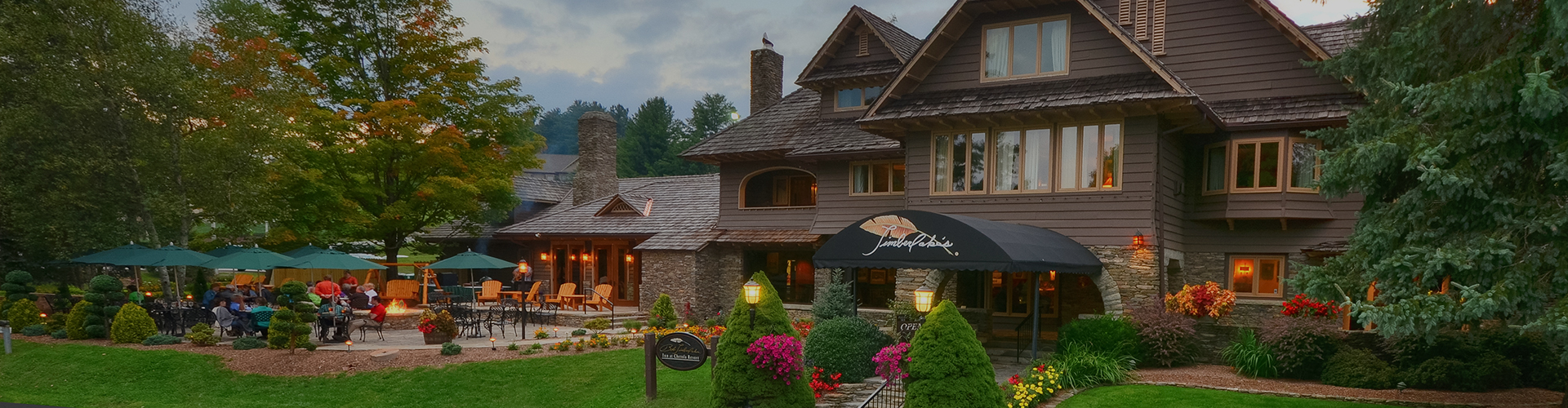 a house with a lawn and flowers
