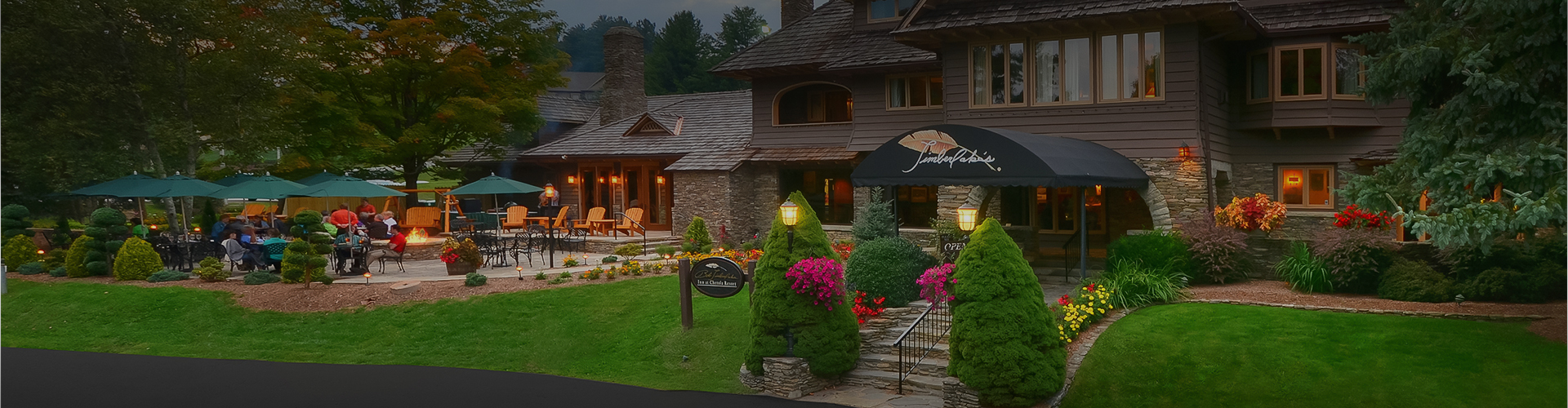 a building with a lawn and bushes