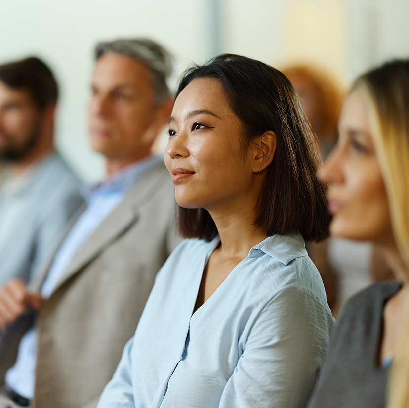 a group of people sitting in a row