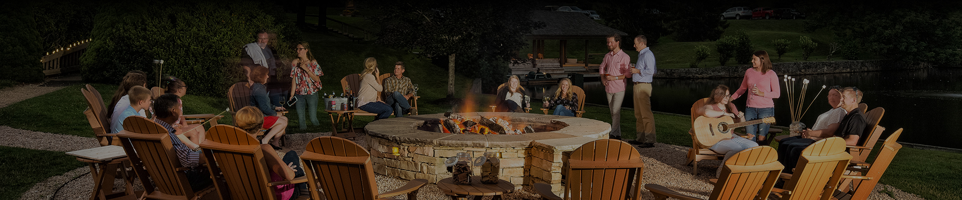 a group of people sitting around a fire pit