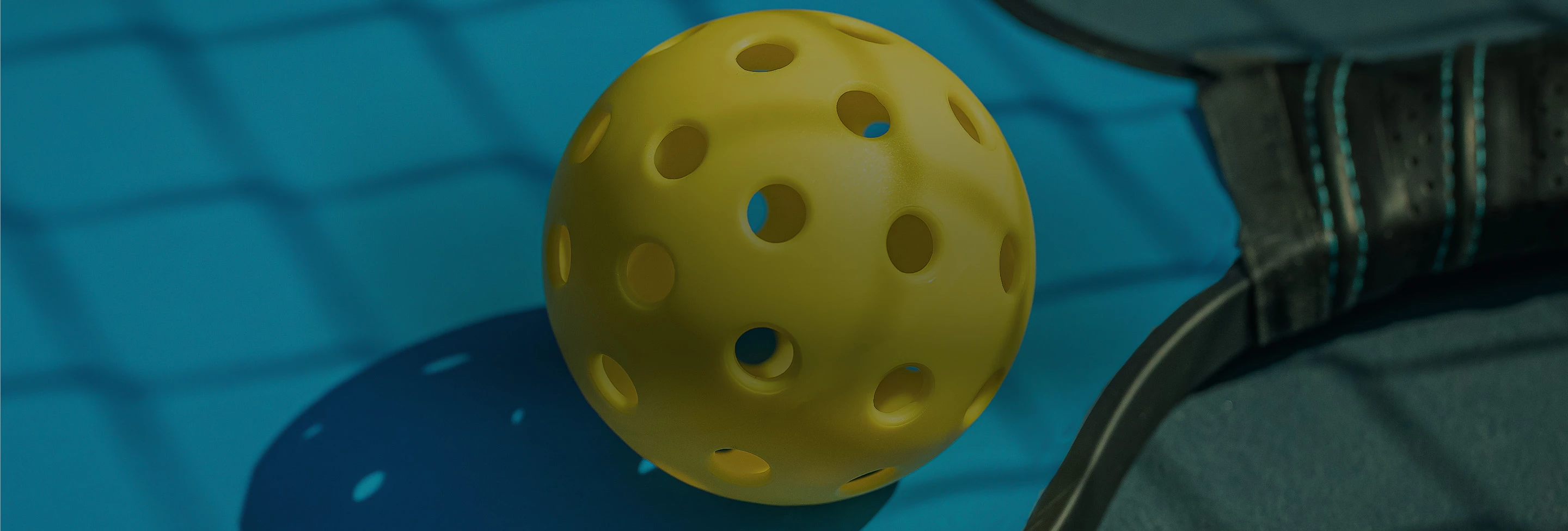 a yellow ball with holes on it
