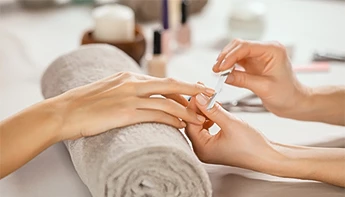 a person getting manicure done