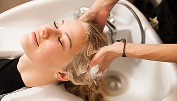 a woman washing her hair