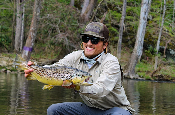 a man holding a fish