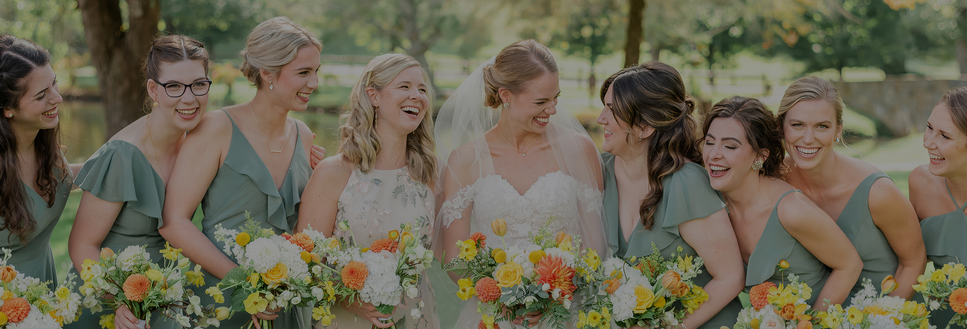 a group of women in dresses with flowers