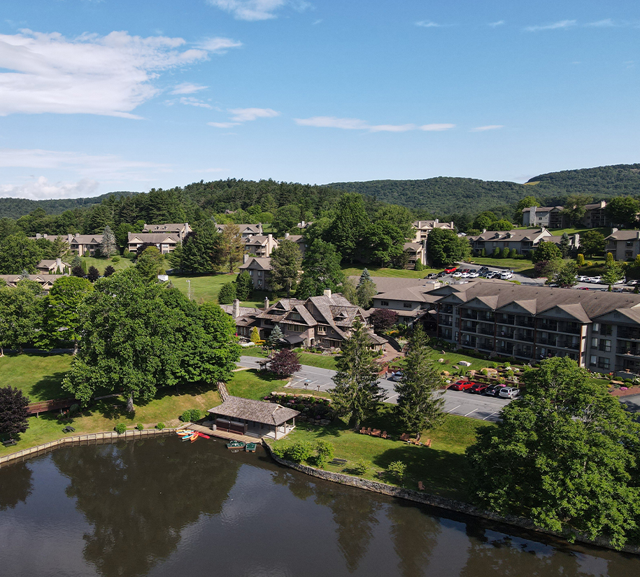 a body of water with buildings and trees