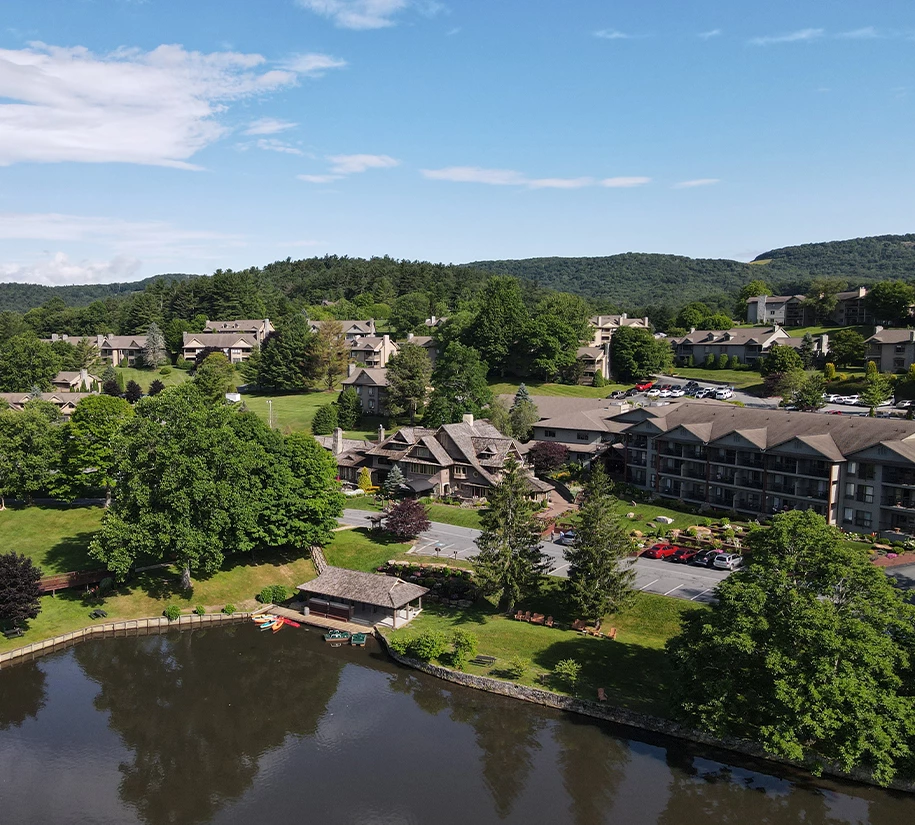 a body of water with buildings and trees