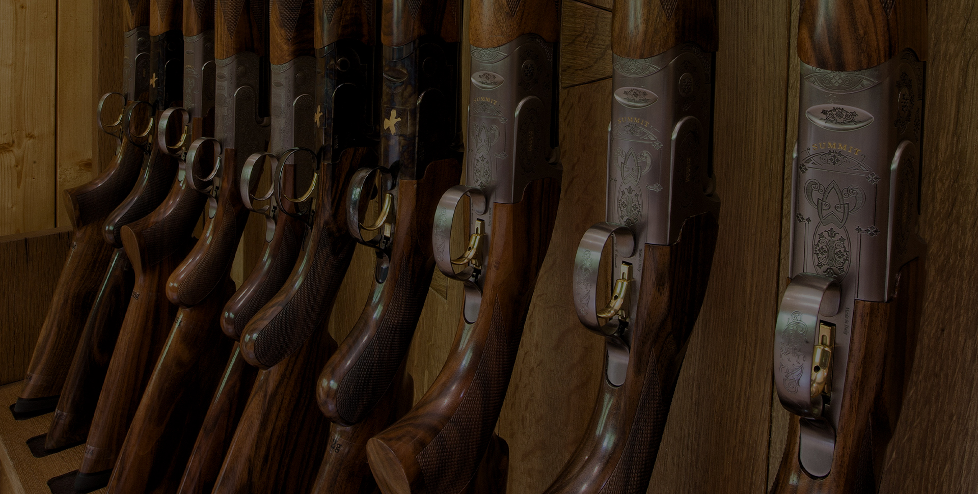 a row of guns on a shelf
