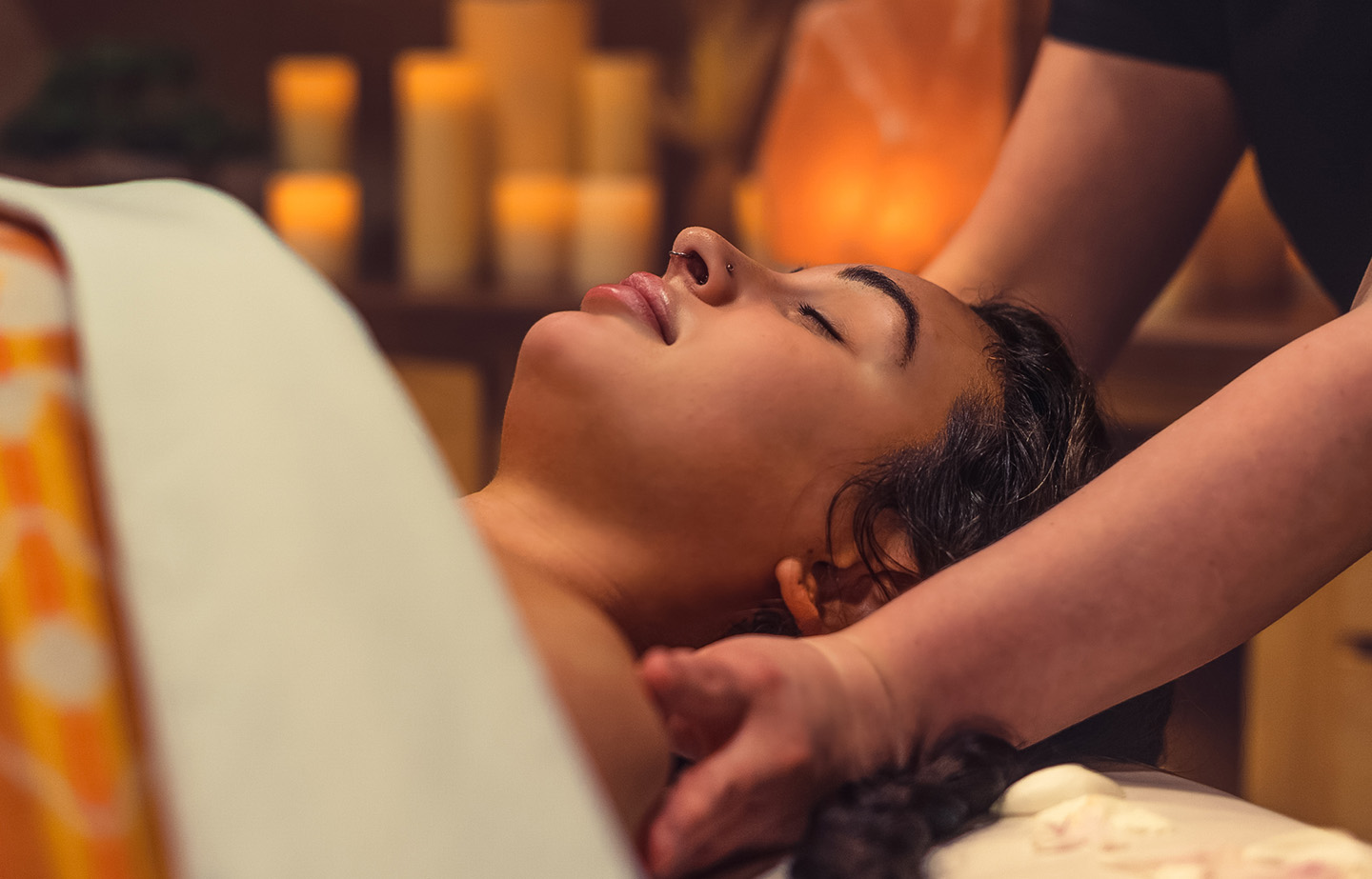 a woman lying down on a massage table