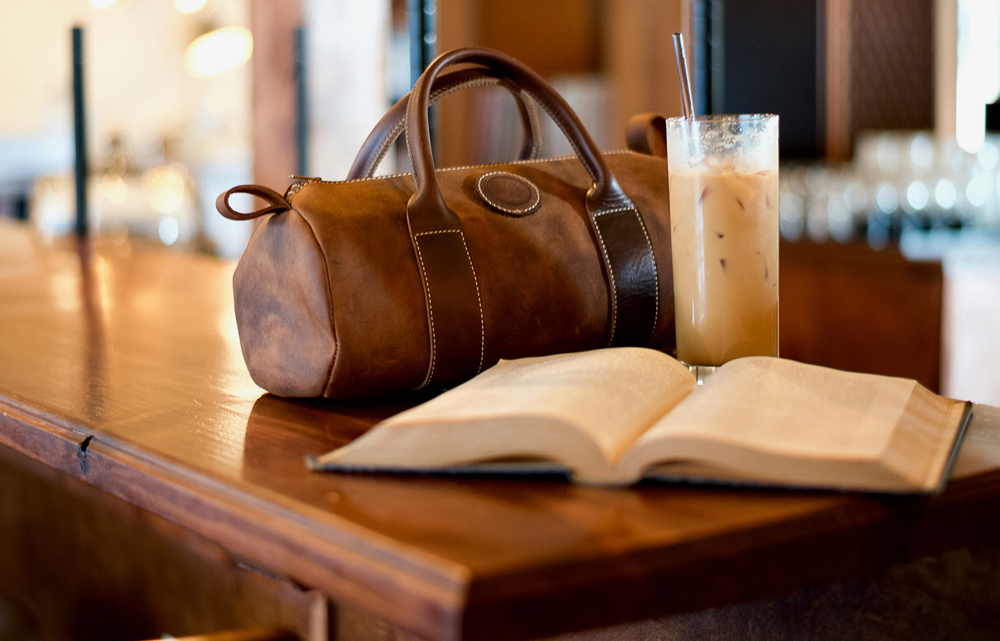 a bag and a drink on a table