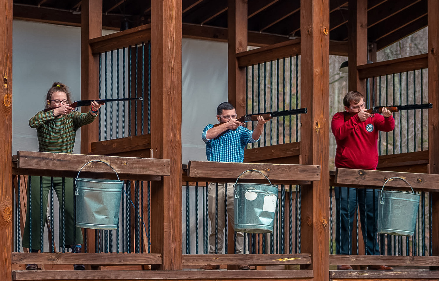 a group of men shooting guns