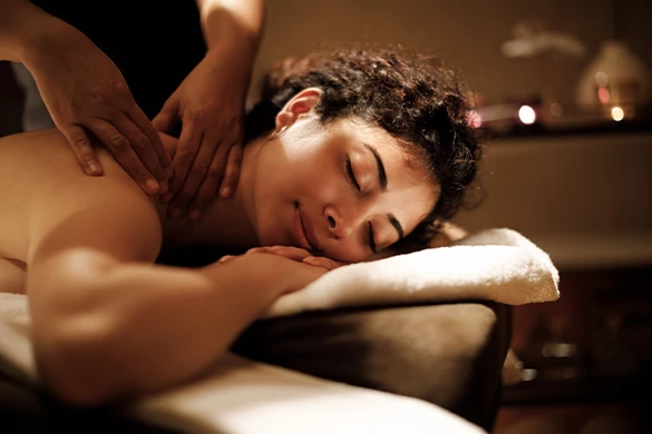 a woman lying down on a massage table