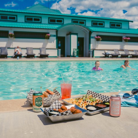 a pool with food and drinks.
