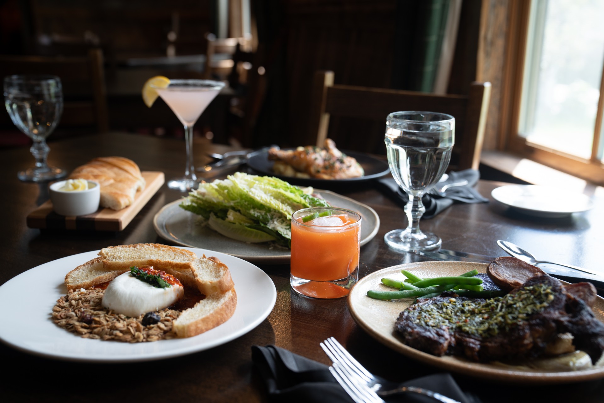 post image for a table with plates of food and drinks.