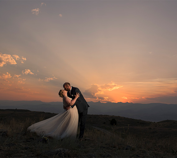 a man and woman kissing in a field image from David Clumpner