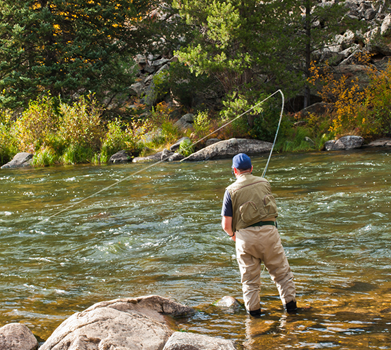 a man fishing in a river