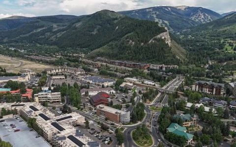 a city with many roads and buildings in the mountains
