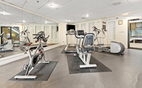 a room with exercise bikes and exercise equipment
