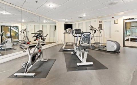 a room with exercise bikes and exercise equipment