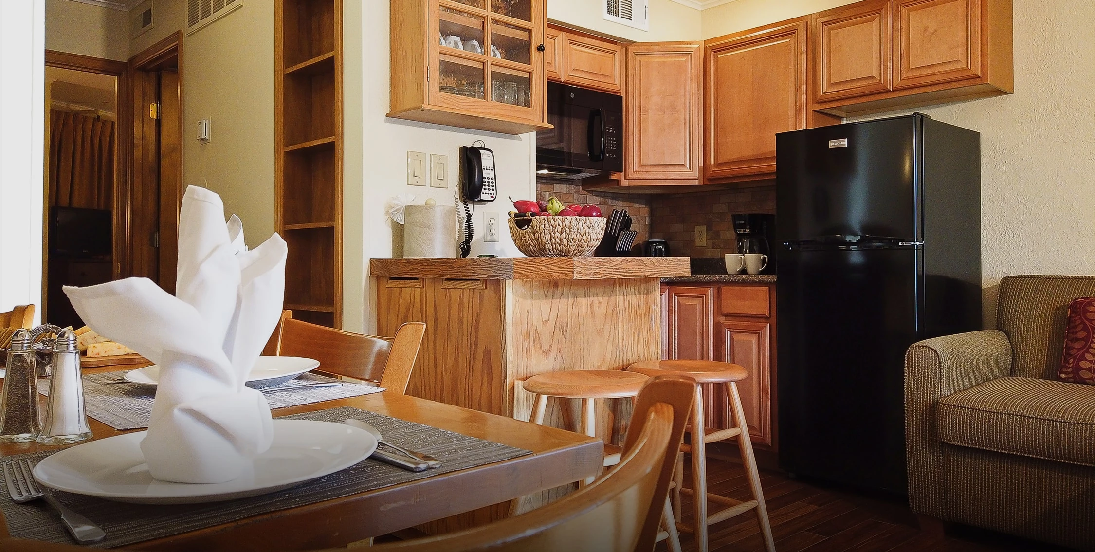 a kitchen with a table and chairs