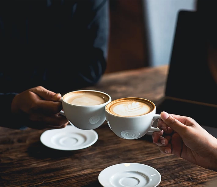 a table with cups of coffee
