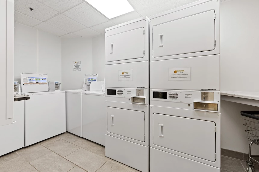 a laundry room with white appliances