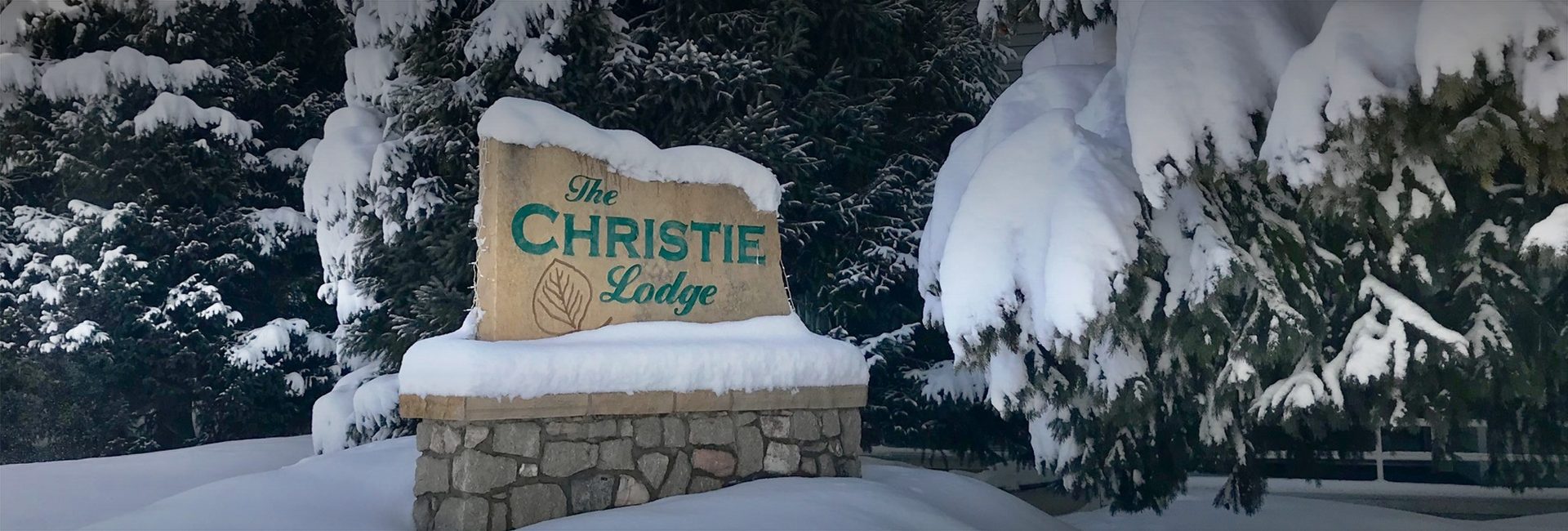 a sign with snow on it