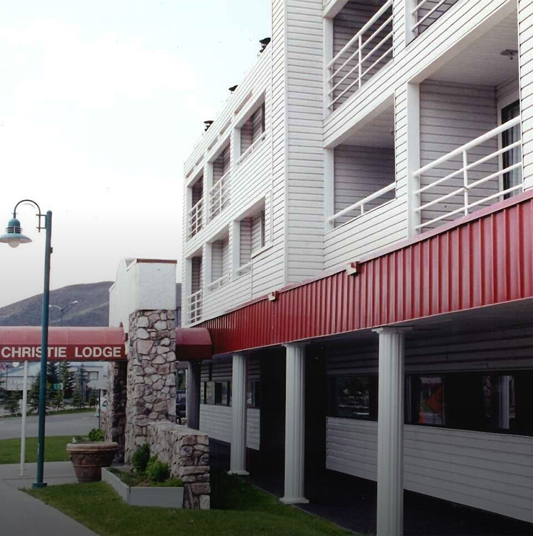 a white building with red roof