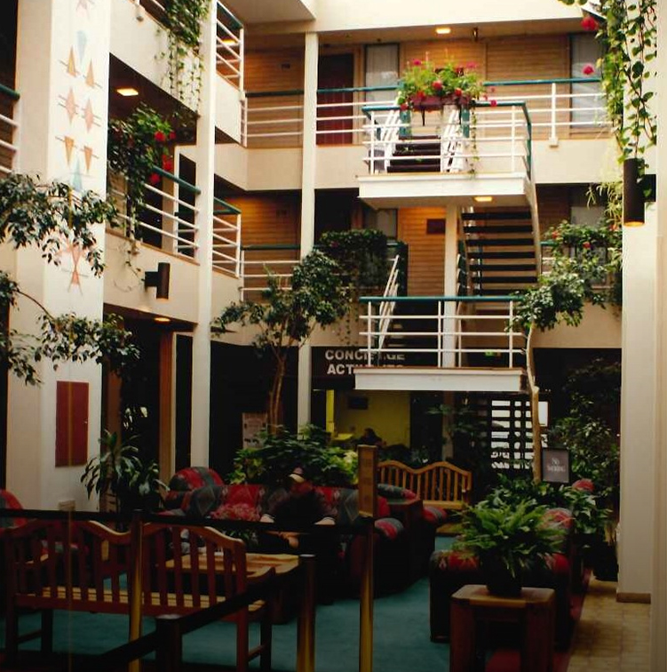 a room with a balcony and stairs