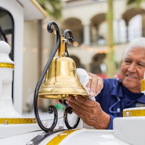 a man cleaning a bell