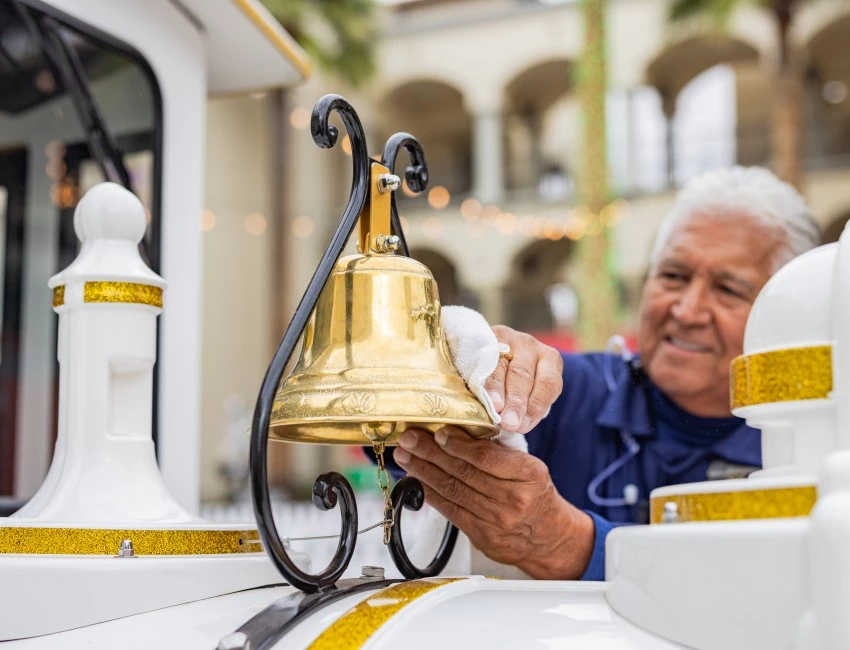 a man cleaning a bell