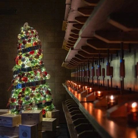 a christmas tree with lights and candles