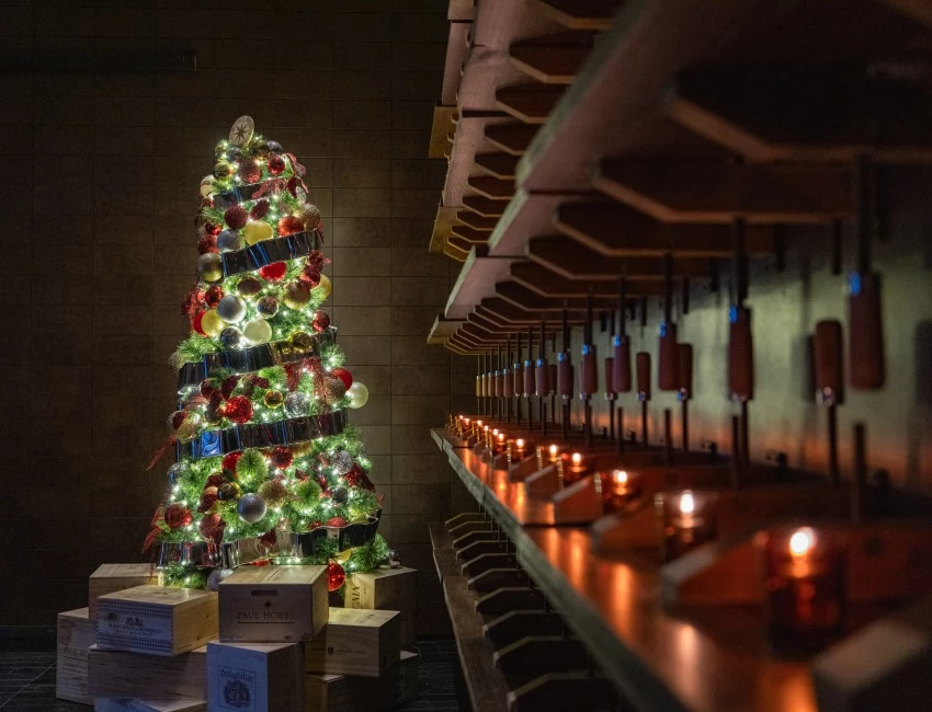 a christmas tree with lights and candles