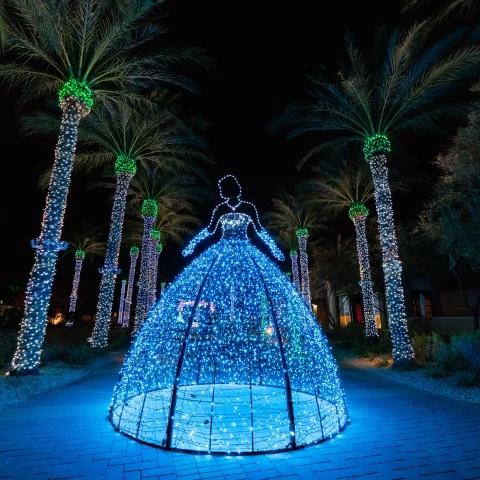 a lighted dress in a tunnel with palm trees smores land 