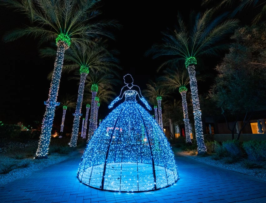 a lighted dress in a tunnel with palm trees smores land