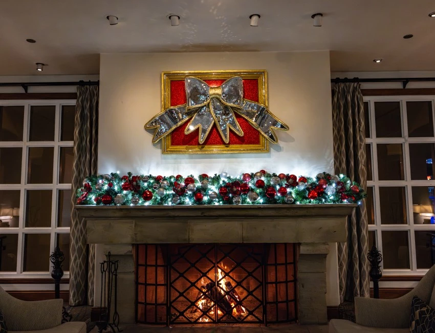 a fireplace with a large bow on top