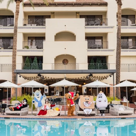 people in clothing by a pool