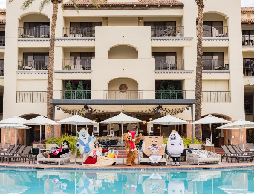 people in clothing by a pool