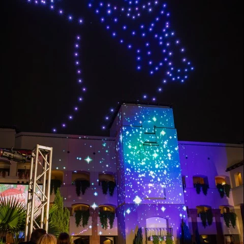 a building with lights in the sky smores land 