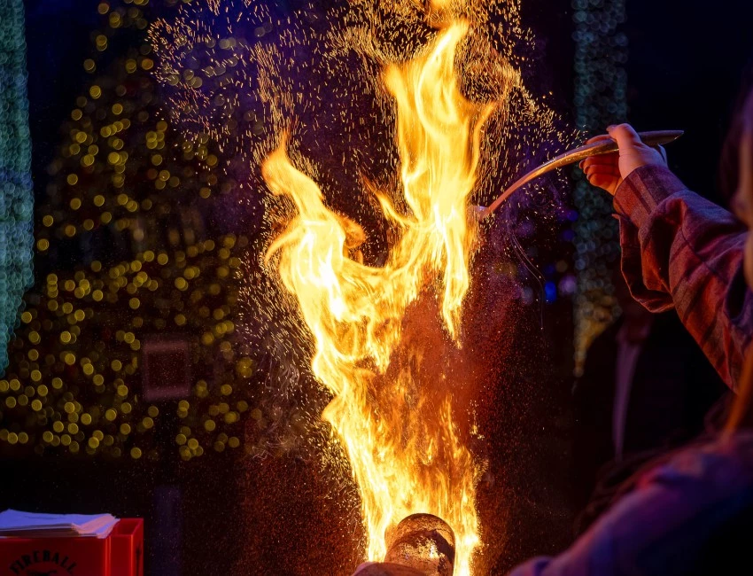 a person lighting a fire